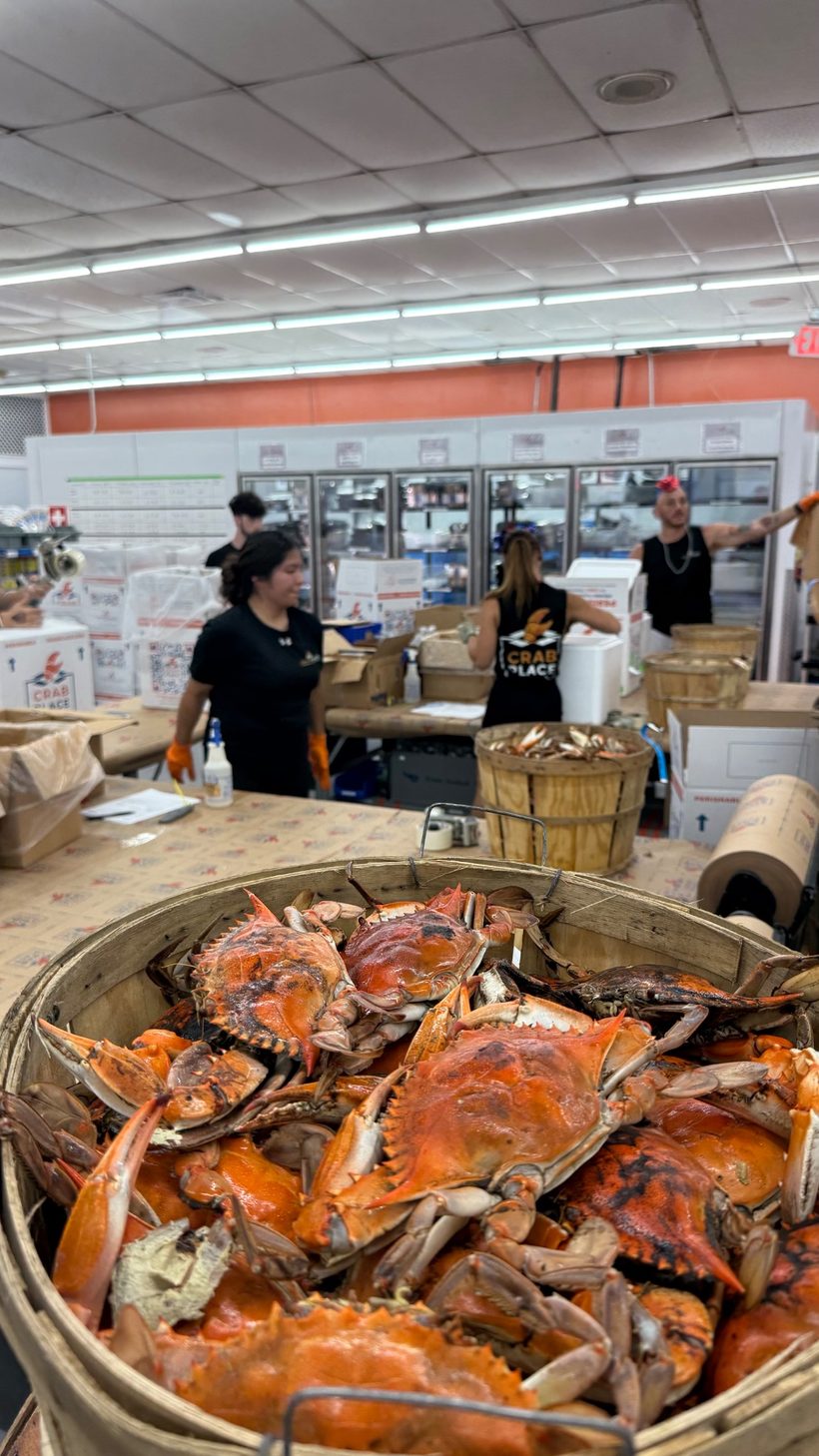 The team packing steamed crabs at the Crab Place facility